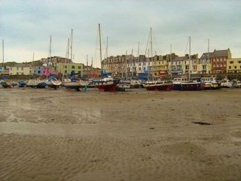 Boats moored at harbor