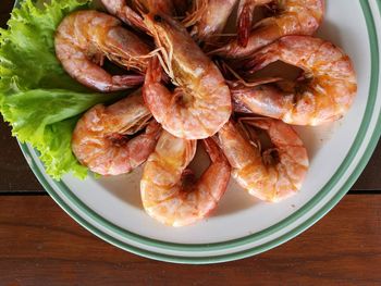 High angle view of roasted prawns in plate on table