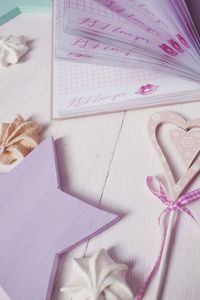 Close-up of art decoration with book on table