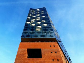 Low angle view of skyscraper against sky