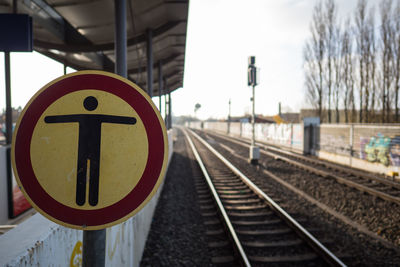 Close-up of railroad tracks against sky