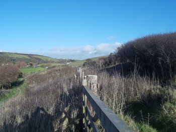 Empty road along landscape