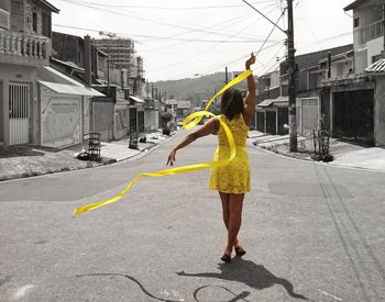 Young woman standing on street
