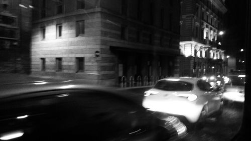 View of car on illuminated street at night