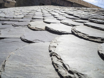 High angle view of weathered wood on footpath