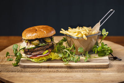 Fresh vegetables on cutting board against black background