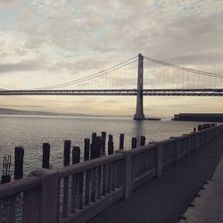 View of suspension bridge over sea