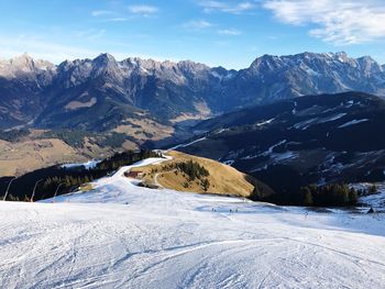 Scenic view of mountains against sky during winter