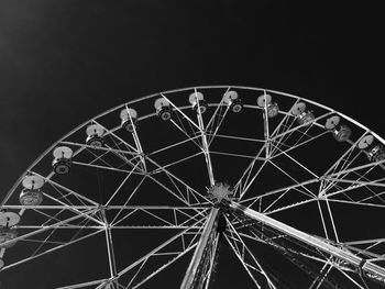 Low angle view of ferris wheel against sky at night