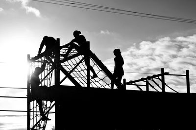 Low angle view of people against sky