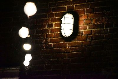 Low angle view of lamp post at night