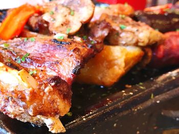 Close-up of meat on barbecue grill