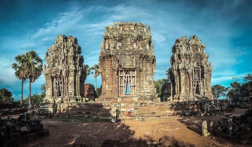 Old ruins of temple against cloudy sky