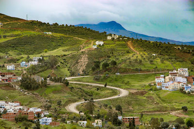 High angle view of houses and mountain against sky