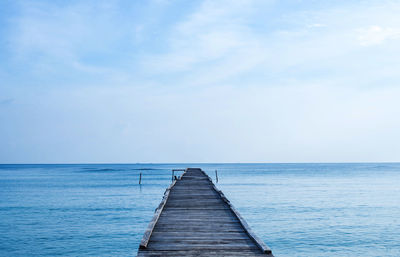 Pier over sea against sky