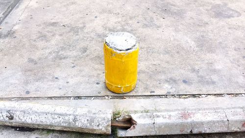 Close-up high angle view of yellow pipe