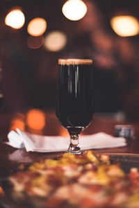 Close-up of wineglass on table