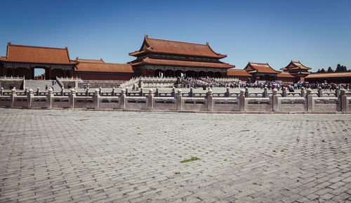 People at forbidden city against clear sky