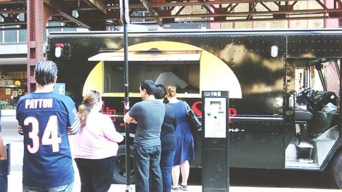 People standing at railroad station