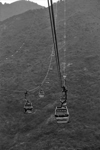 Low angle view of overhead cable car on sea