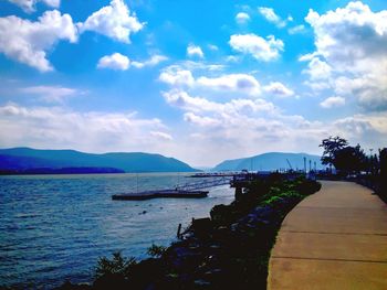 Scenic view of sea against cloudy sky