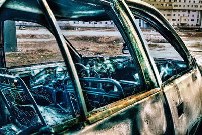 Close-up of abandoned car