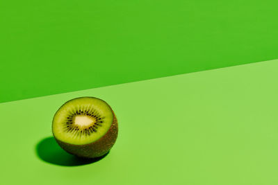 Close-up of banana against green background