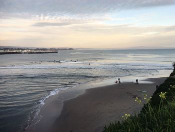 Scenic view of beach against sky during sunset