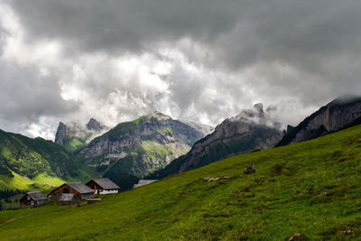 Scenic view of landscape and mountains against sky