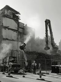 People on built structure against sky