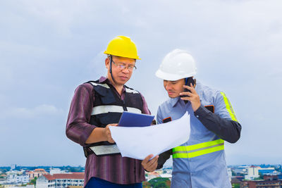 Man working against clear sky