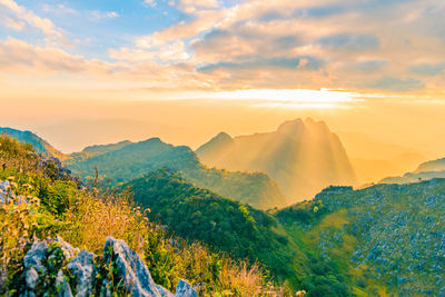 Scenic view of mountains against sky during sunset