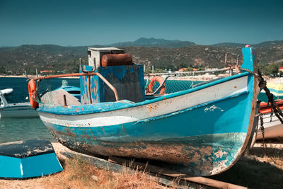 Boats moored at beach