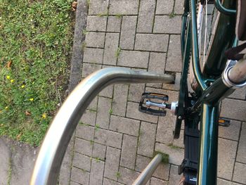 High angle view of bicycle parked on footpath