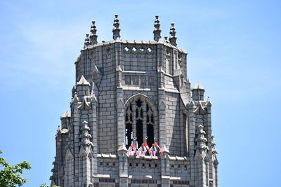 Low angle view of historical building against blue sky