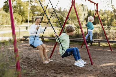 Mother with children on playground