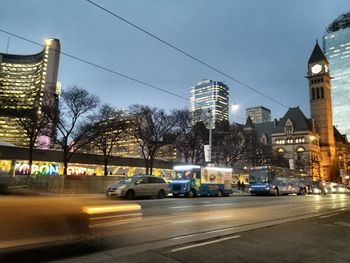 Cars on city street at night