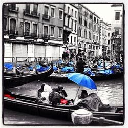 People on boat in city