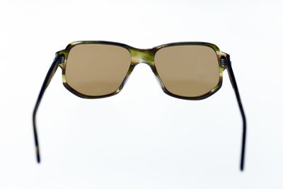 Close-up of sunglasses against white background