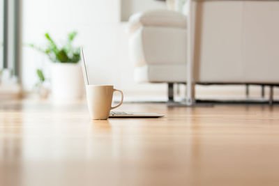 Coffee cup on table at home