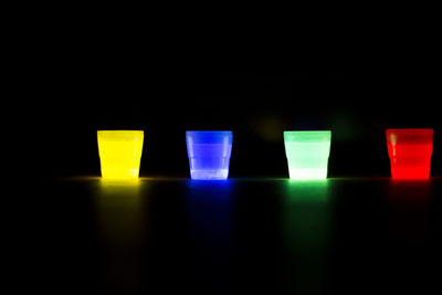 Close-up of multi colored pencils against black background