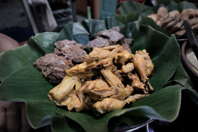 High angle view of meat on leaves