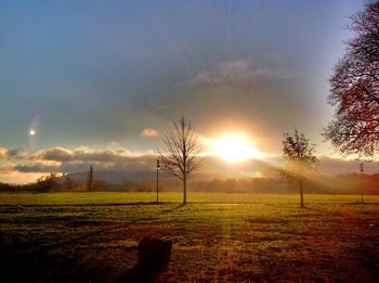 Scenic view of field against sky during sunset