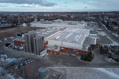 Logistic warehouse in suburban area, aerial view. industrial center with factory