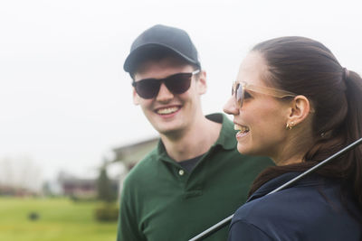 Young couple playing golf together