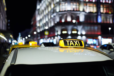 Information sign on illuminated city at night