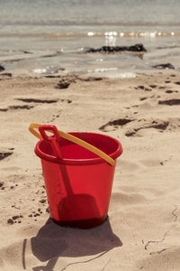 Red toy on beach