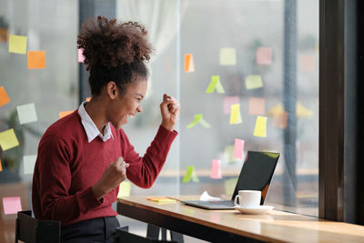 Side view of business colleagues working at office