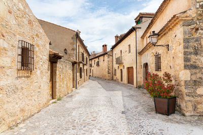 Narrow alley amidst buildings in town