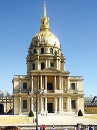 Low angle view of building against blue sky